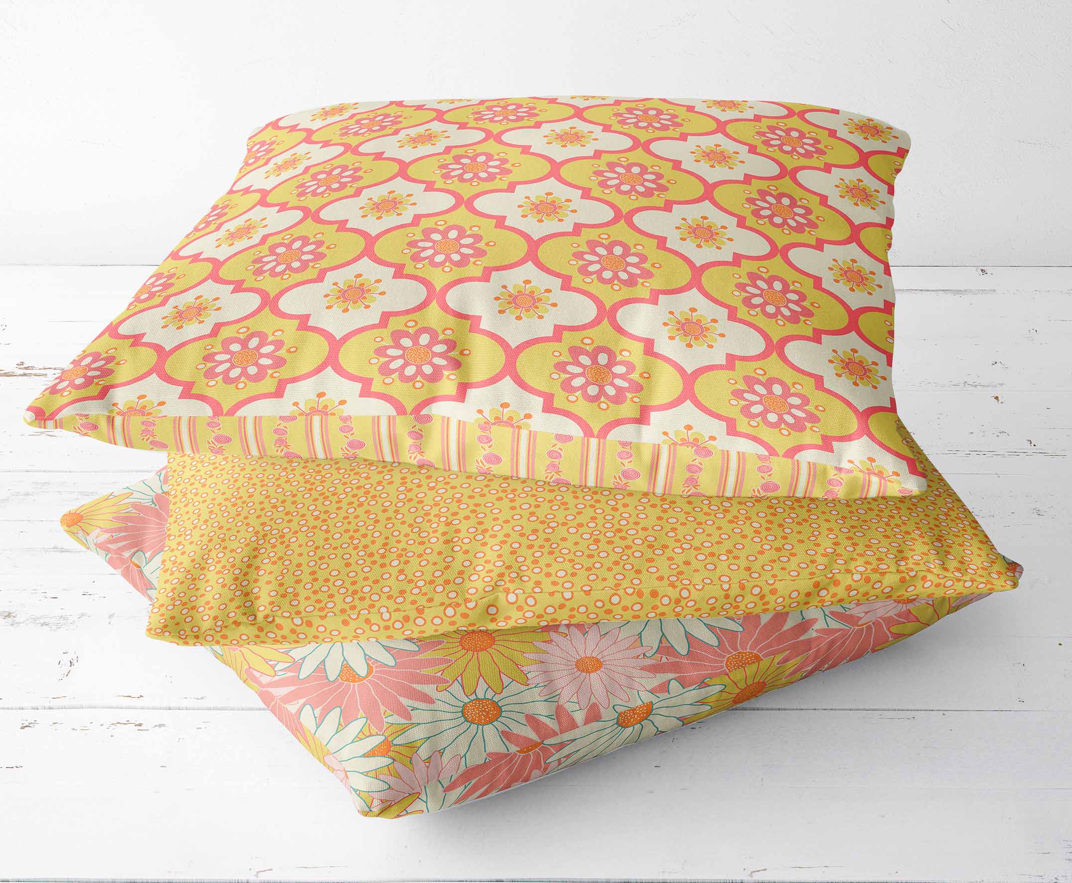 Throw pillows with patterns from Buds, Blossoms, Wings collection. Patterns are Flower Power, Joyous Pollen, Field of Daisies